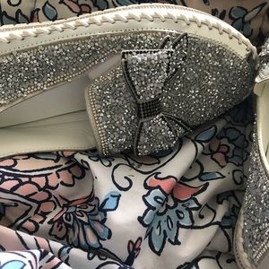 Sliver slip on shoes with rhinestones.